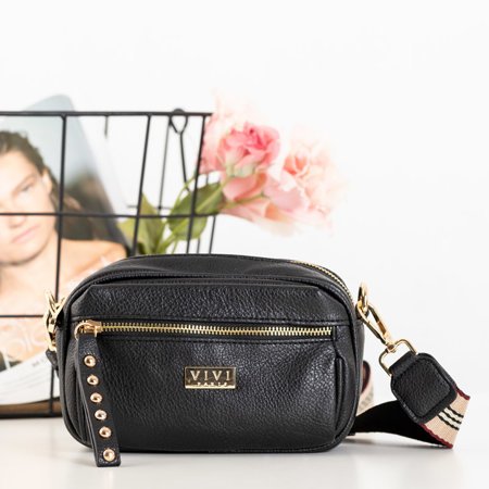 A small women's handbag on a black frame - Handbags