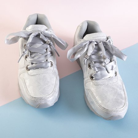 Women's white sports shoes with a silver trim, tied with a Sobesq ribbon - Footwear