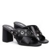 Black flip-flops on the Tres post - Footwear