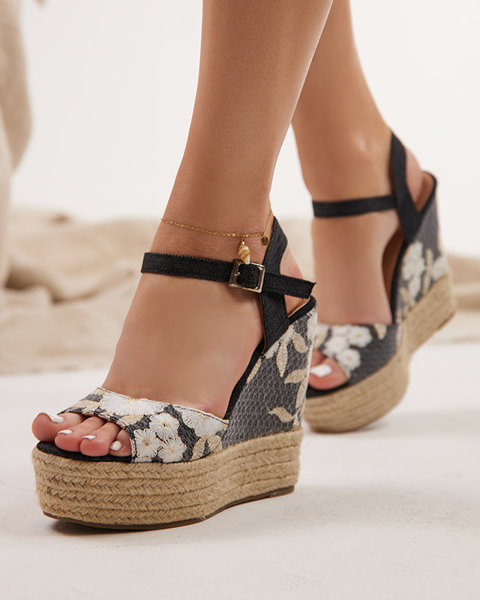 Black women's sandals with flowers on a higher wedge Nerelid - Footwear
