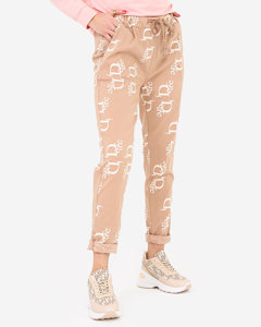 Ladies' beige fabric trousers with inscriptions - Clothing