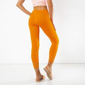 Orange women's leggings with lace - Clothing