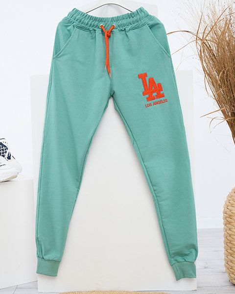 Women's green sweatpants with a colored patch - Clothing